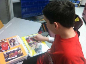 Aidan shares his photo communication book