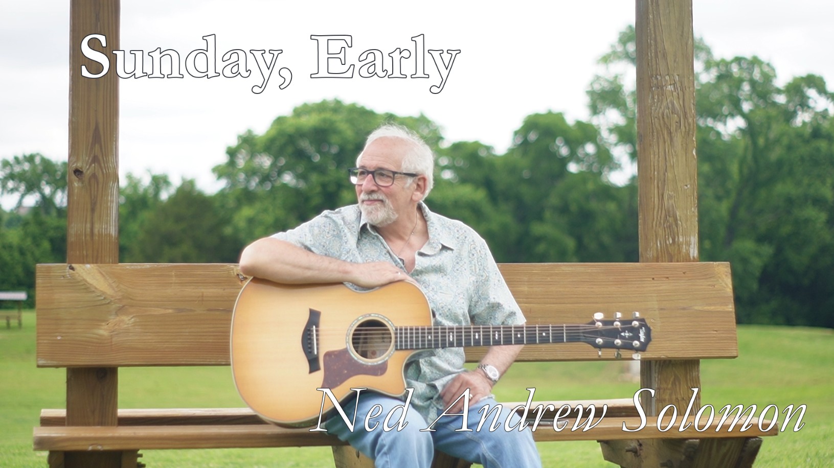 Sunday Early Thumbnail with Ned Andrew holding his Taylor Acoustic Guitar