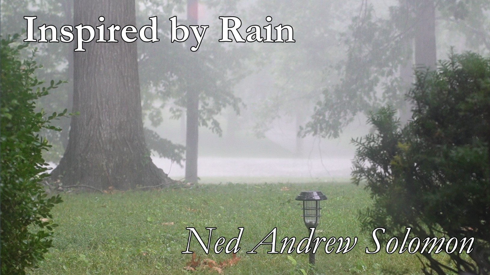 Inspired by Rain Thumbnail with heavy rain falling on grass, trees, and bushes
