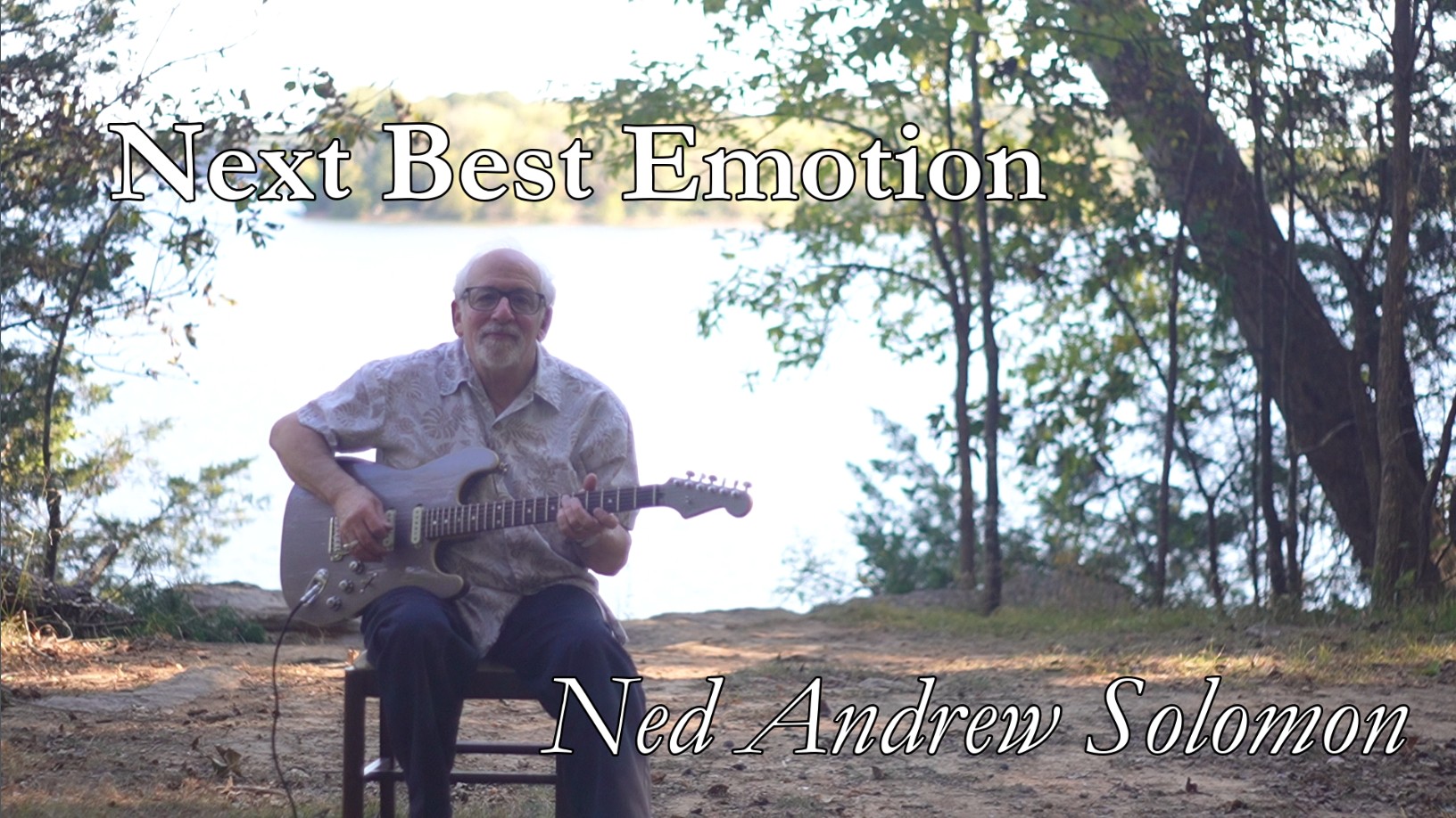 Next Best Emotion Thumbnail with Ned Andrew holding his Fender electric Guitar